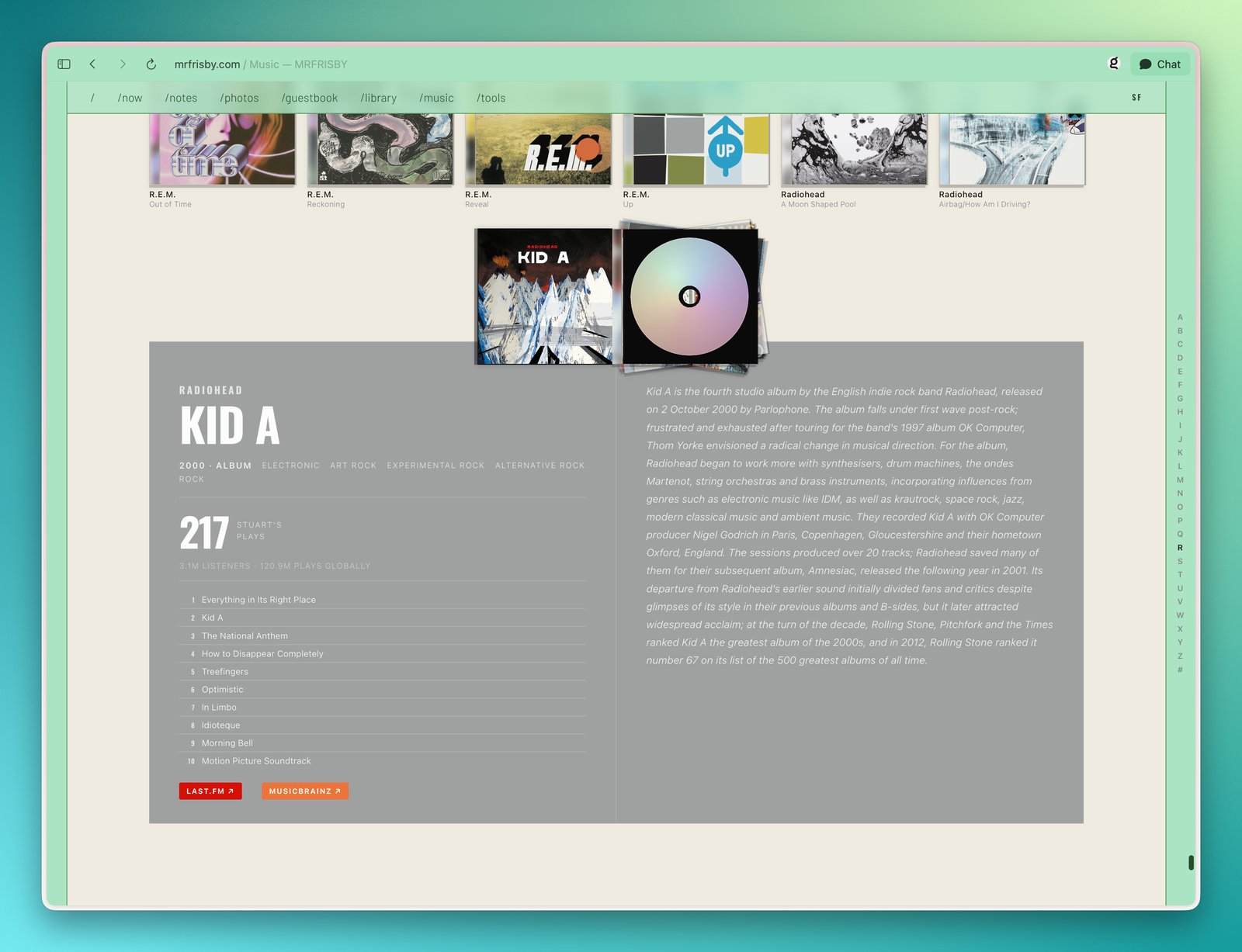 An open Radiohead Kid A jewel case on /music, showing the printed spine, the disc, and the album's info panel with play stats, a tracklist, and genre tags