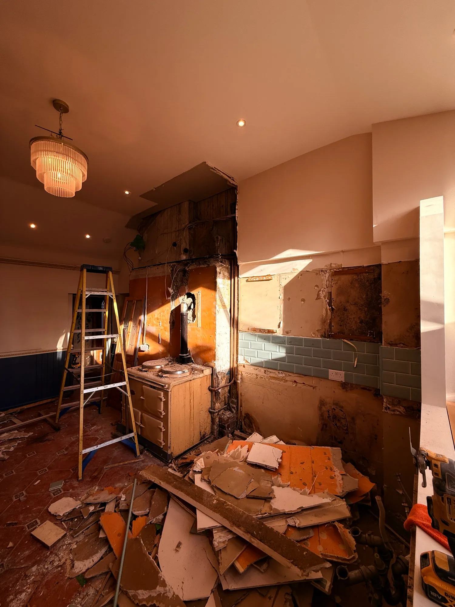 End of day 1 - most of the kitchen is now ripped out and some of the stud walls have been — photo 1 of 2.