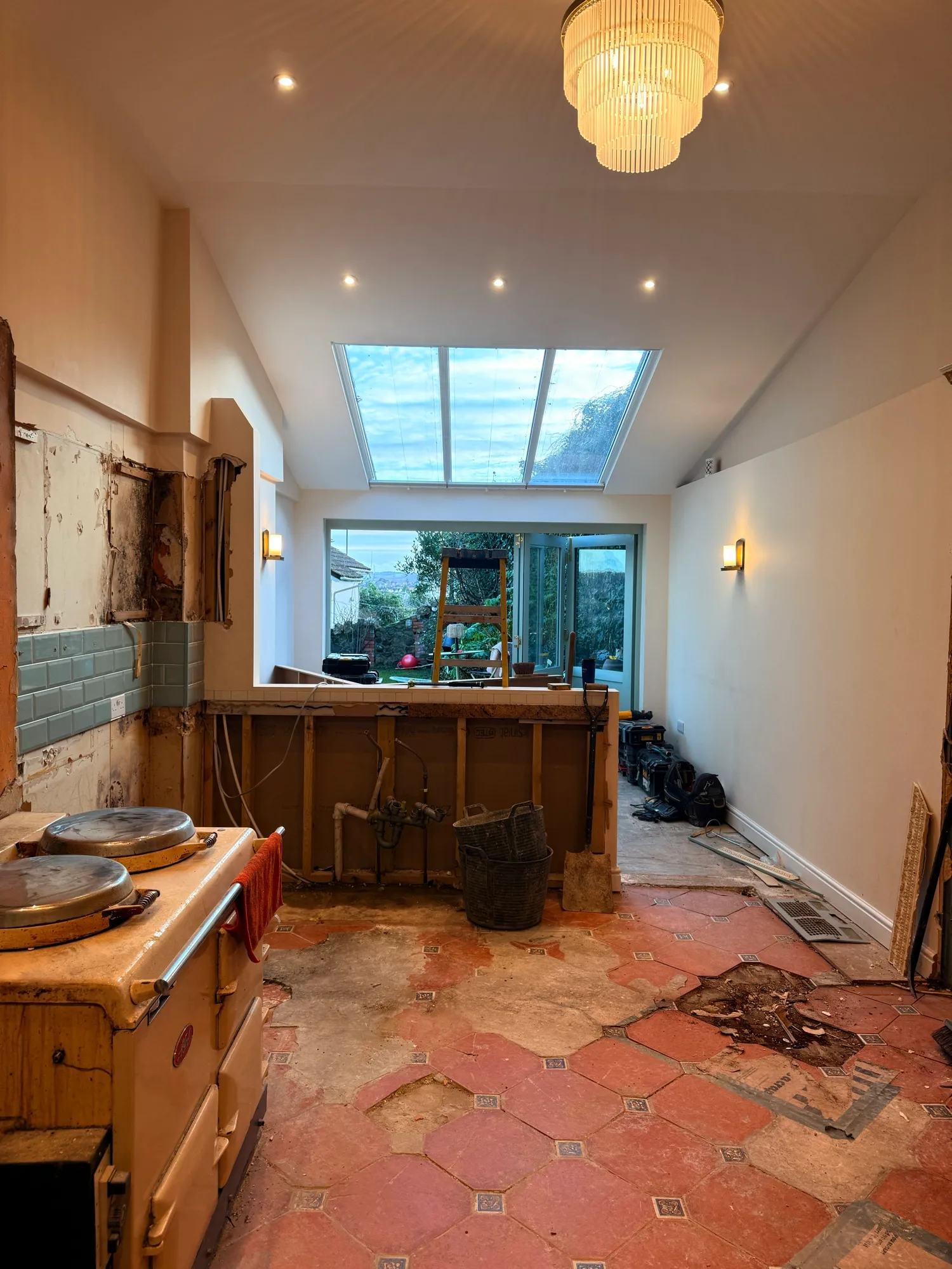End of day 1 - most of the kitchen is now ripped out and some of the stud walls have been — photo 2 of 2.