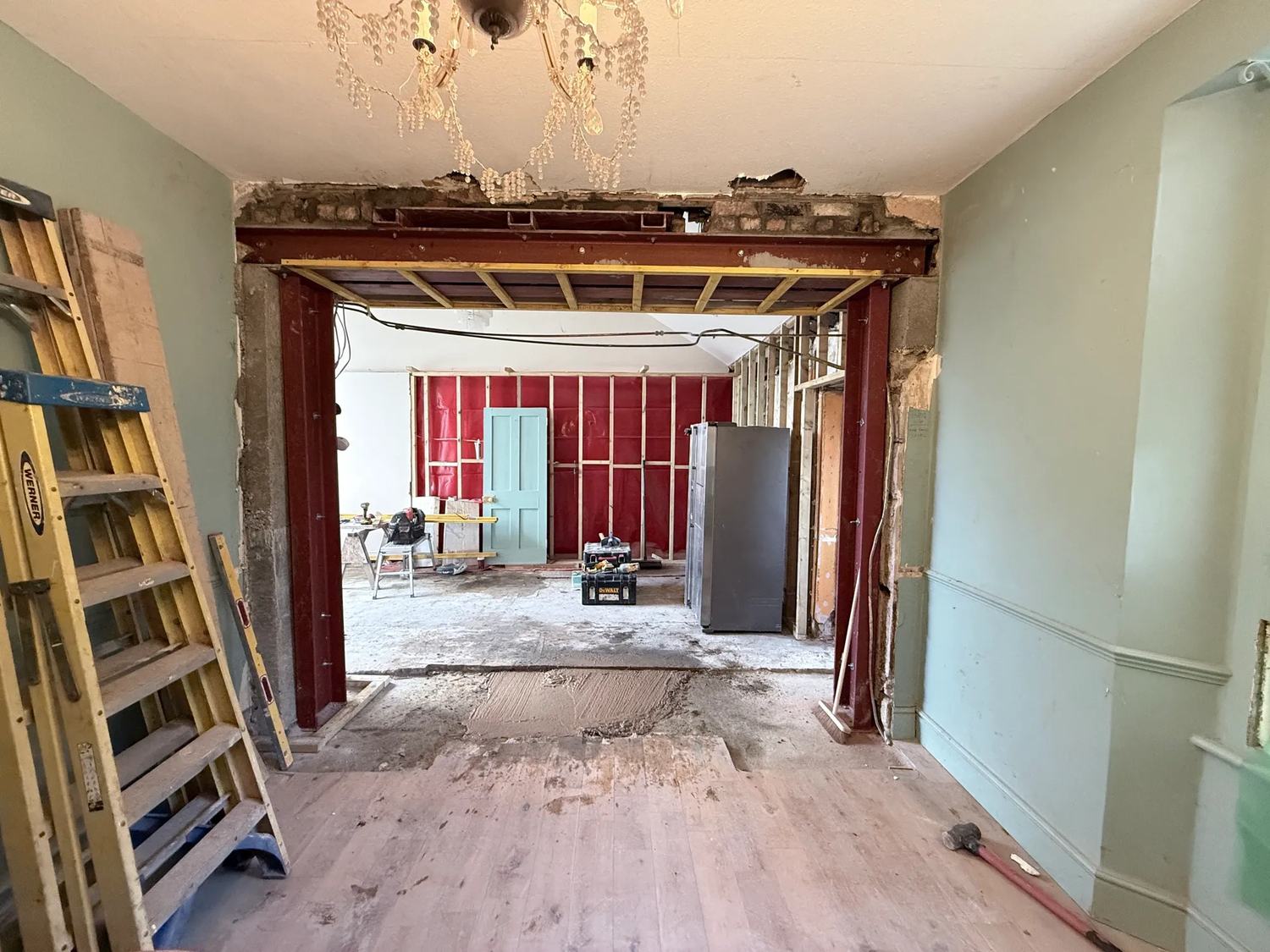 The hole in the house is now supporting itself and the framing is starting to go up around — photo 3 of 3.