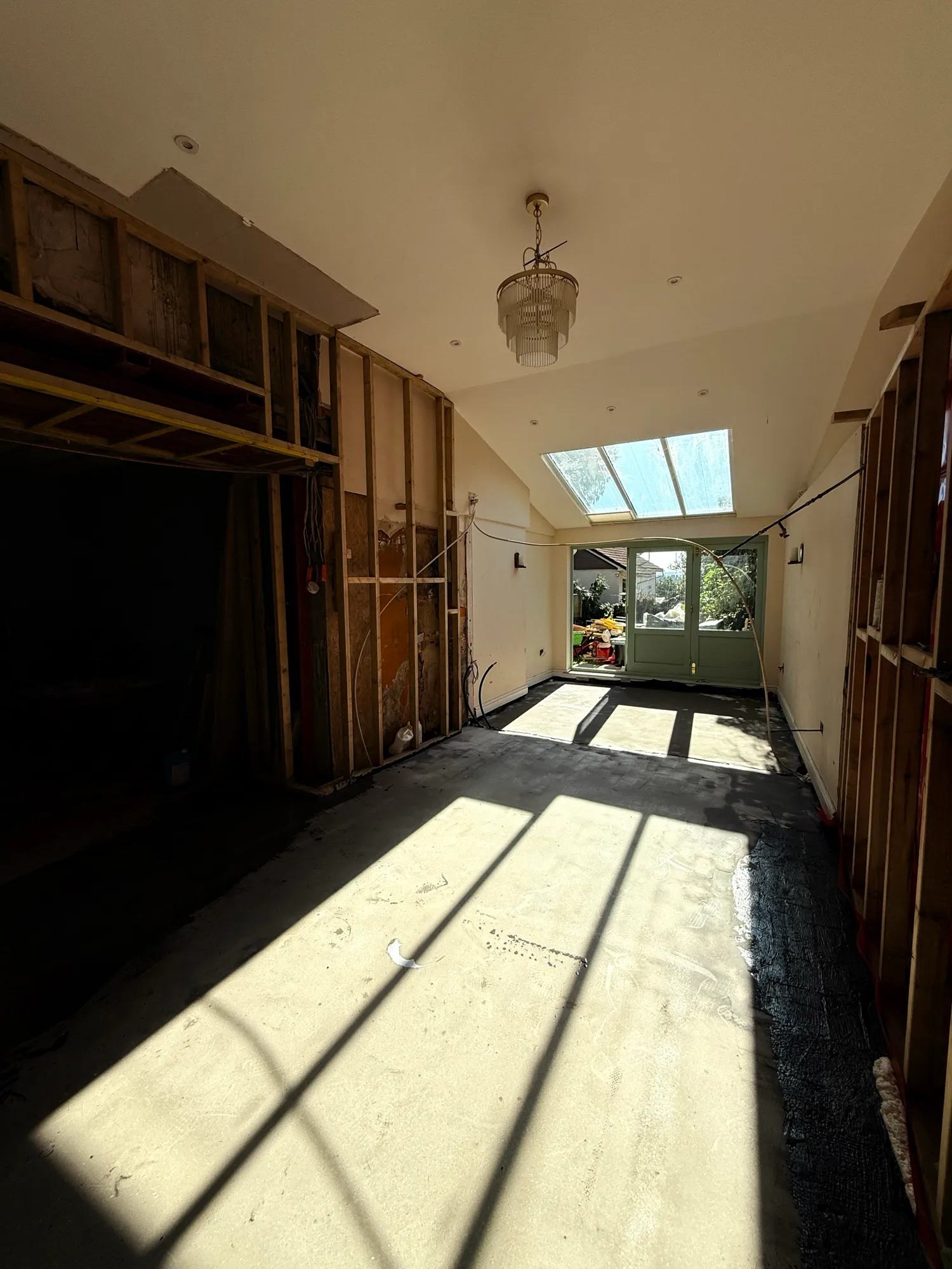We now have a latex screed on top of the damp proofing in the larger half of the space — photo 1 of 2.