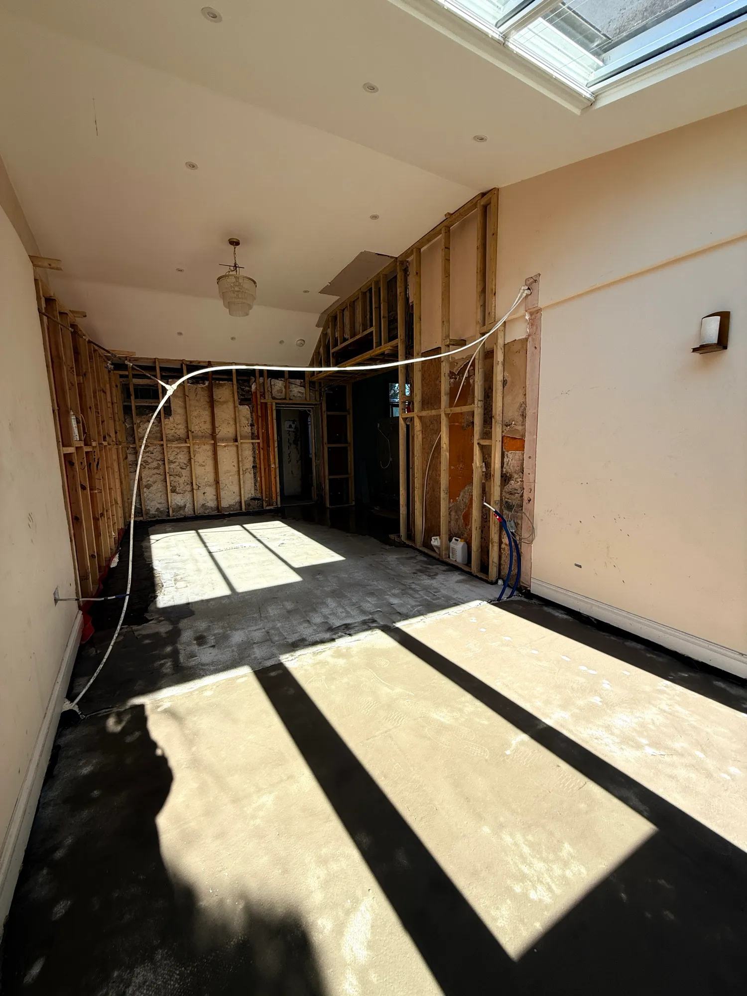 We now have a latex screed on top of the damp proofing in the larger half of the space — photo 2 of 2.