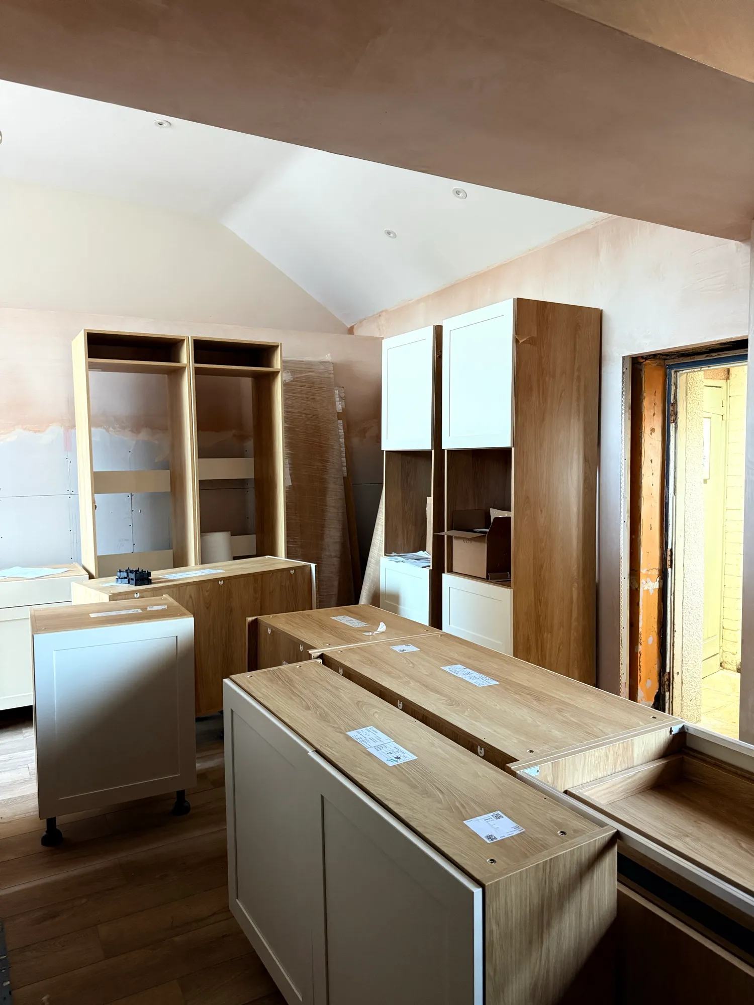 The corner where the pantry units is going with the ovens on one side and the fridge units on the other.