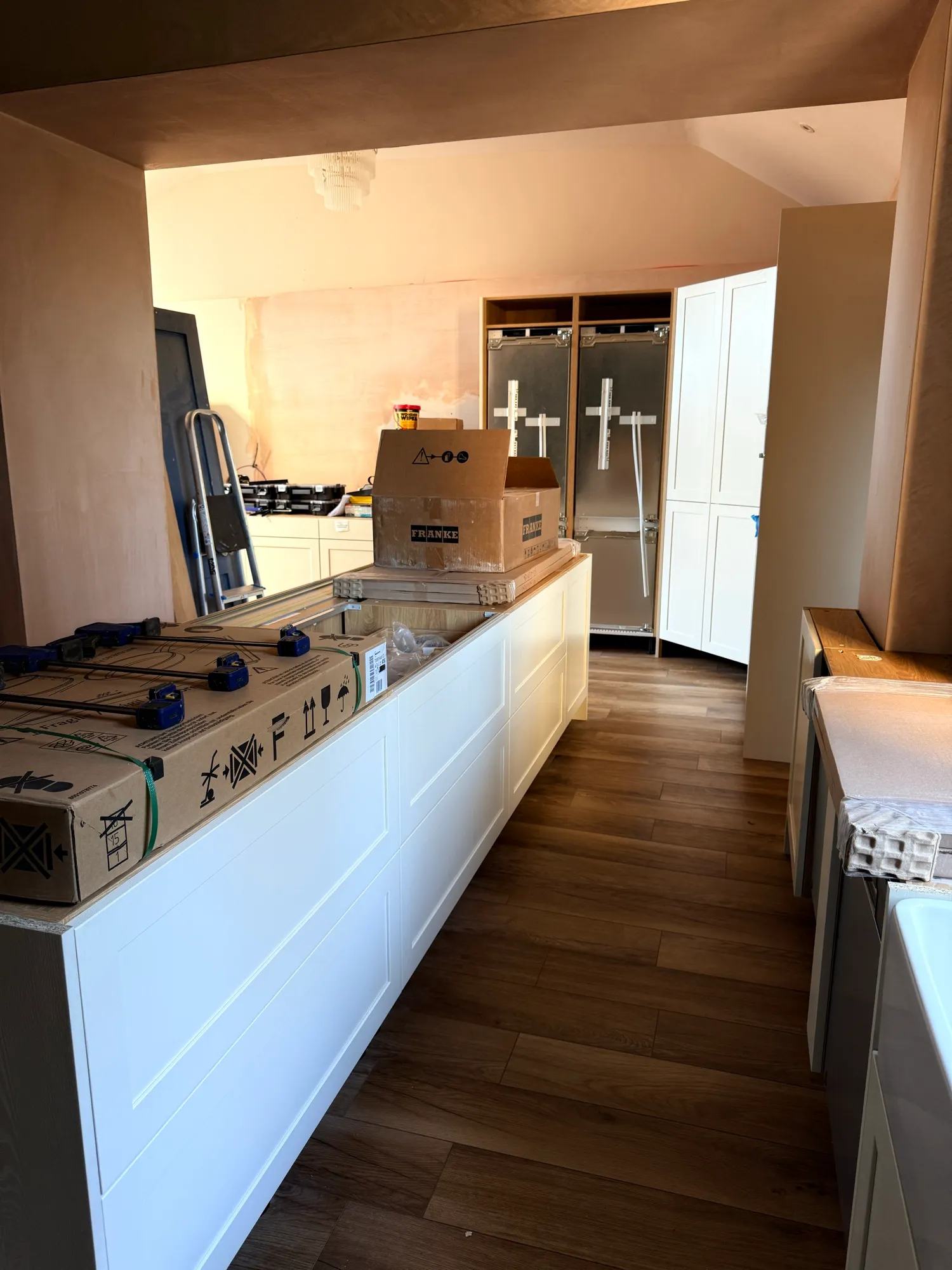 The sink is getting fitted, the back side of the island is now all sorted and the pantry d — photo 3 of 3.